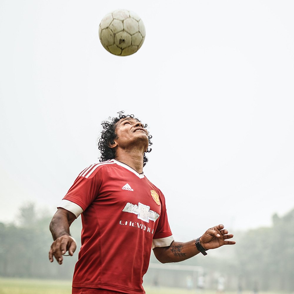 image of man playing soccer